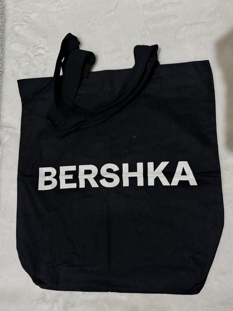 Bershka Black Tote Bag (Category: Tote Bags) located in Quezon City. Submitted by trade_mnl (Listing ID 1464240448, Image 1). Description: Used once then stored. All goods pa po. Bought for 225. Original. - Classic black tote bag from Bershka - Simple and spacious design - Ideal for everyday use, shopping, or carrying essentials - Made with durable material - Features comfortable handles for easy carrying.