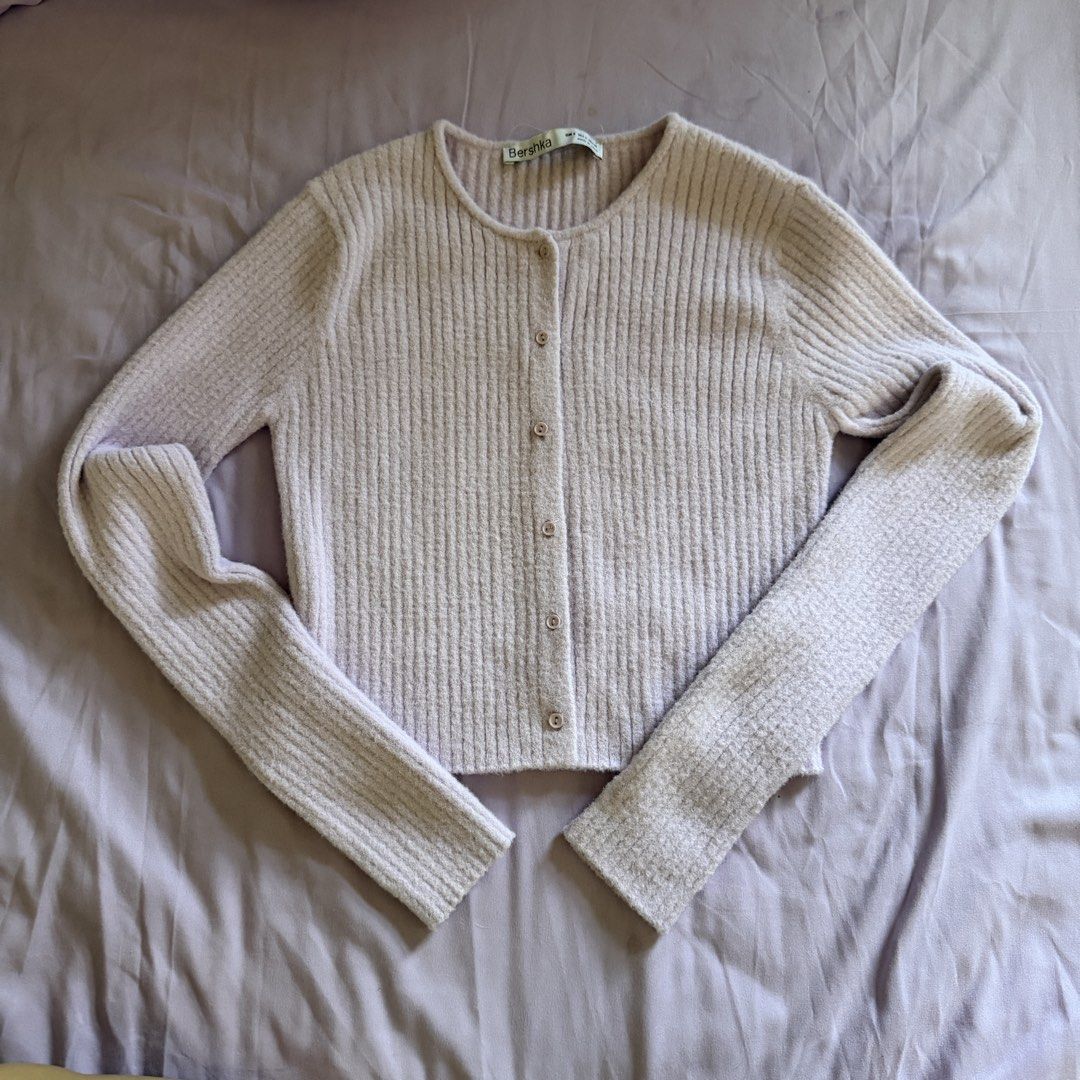 Bershka Ribbed Knit Button-Up Cardigan (Category: Coats, Jackets and Outerwear) located in Manila. Submitted by dyjamie (Listing ID 1464218228, Image 1). Description: - Brand: Bershka - Color: Light Purple - Material: Ribbed Knit - Style: Button-up Cardigan - Features: Long sleeves, cropped length, soft fuzzy texture - Occasion: Perfect for layering, comfy and cute.