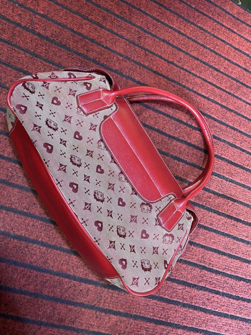 Betty Boop Monogram Canvas & Leather Handbag (Category: Luxury Bags & Wallets) located in Calamba. Submitted by curlybang (Listing ID 1464143240, Image 1). Description: - Adorable Betty Boop print handbag - Features red leather trim and handles - Secure zipper closure - Fun monogram pattern with hearts and Betty Boop faces - Perfect for daily use or as a stylish accessory - Shows some signs of wear, but still in good usable condition.