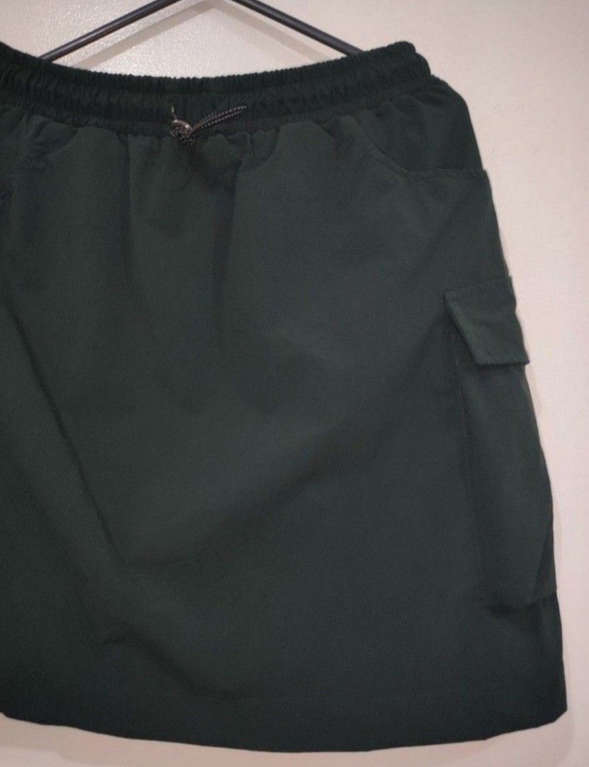 Beyondwearco. Green Cargo Skirt (Category: Skirts) located in Quezon City. Submitted by maxsab (Listing ID 1464236094, Image 2). Description: - Trendy cargo skirt with high-quality, breathable fabric - With two side pockets and adjustable waist tie.