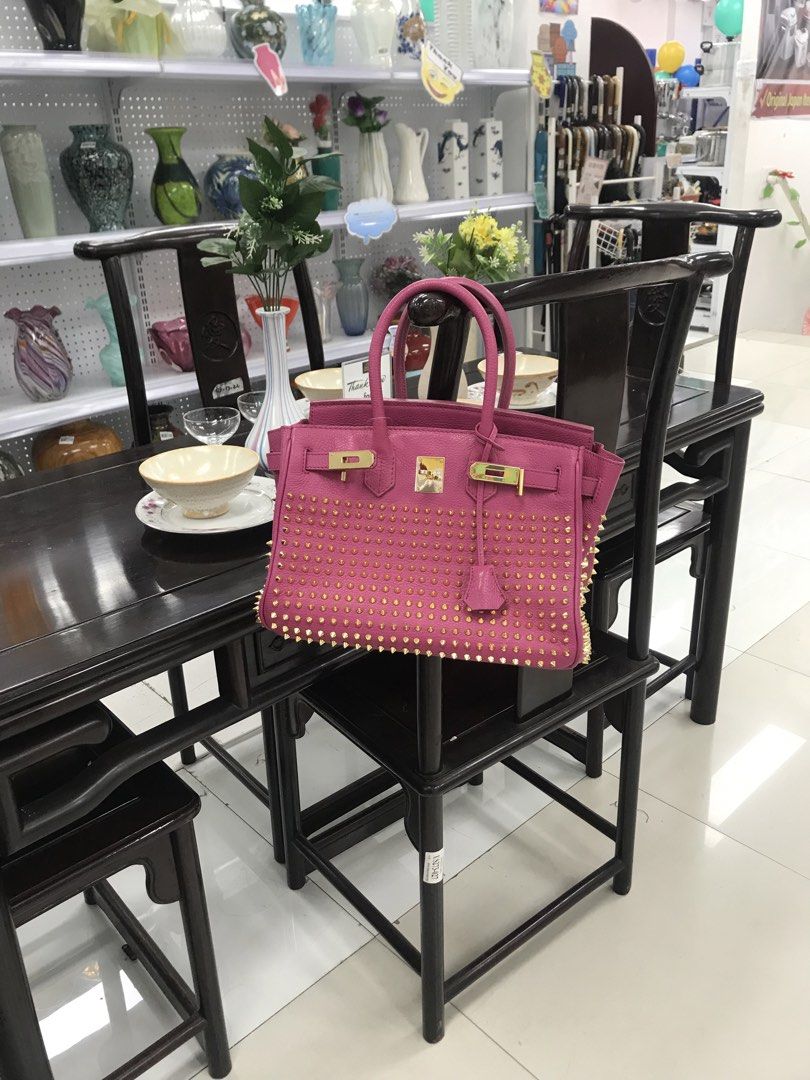 Birkin pink studs (Category: Tote Bags) located in Balete No 2. Submitted by troyesybang (Listing ID 1464228680, Image 1). Description: Pink birkin leather studs Minor sign of use still like new Intact all studs Barbie pink genuine leather With zip and slide pockets inside No niche brand stamp Clean and ready to use Studs are evenly shiny ✨ not overly saturated gold tone di masakit sa mata Luxurious without breaking the bank Bakal hardware not pl