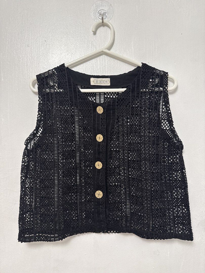 Black Crochet Button-Up Vest (Category: Sleeveless) located in Mandaluyong City. Submitted by nftp24 (Listing ID 1464141559, Image 1). Description: - Black crochet vest - Button-up front with wooden buttons - Sleeveless design - Ideal for layering over tops or dresses - Unique texture and pattern Bought in Ukay-ukay.
