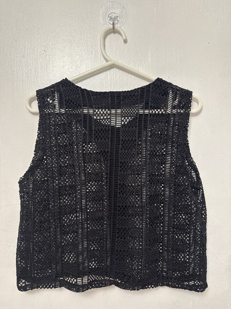 Black Crochet Button-Up Vest (Category: Sleeveless) located in Mandaluyong City. Submitted by nftp24 (Listing ID 1464141559, Image 3). Description: - Black crochet vest - Button-up front with wooden buttons - Sleeveless design - Ideal for layering over tops or dresses - Unique texture and pattern Bought in Ukay-ukay.