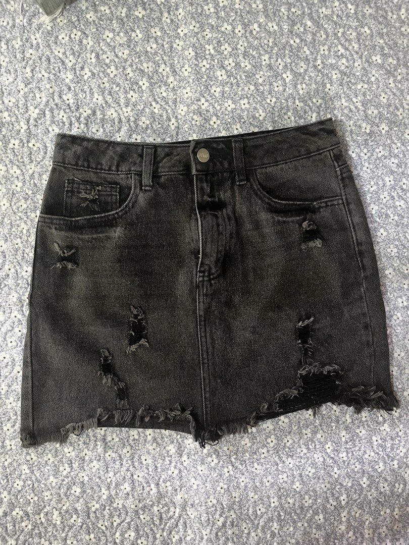 Black Distressed Denim Mini Skirt (Category: Skirts) located in Manila. Submitted by gdwmtine_28 (Listing ID 1464268598, Image 1). Description: - Black denim mini skirt - Distressed details and frayed hem - Classic five-pocket styling - Button and zip closure - Casual and edgy vibe - Pairs well with tees or crop tops.