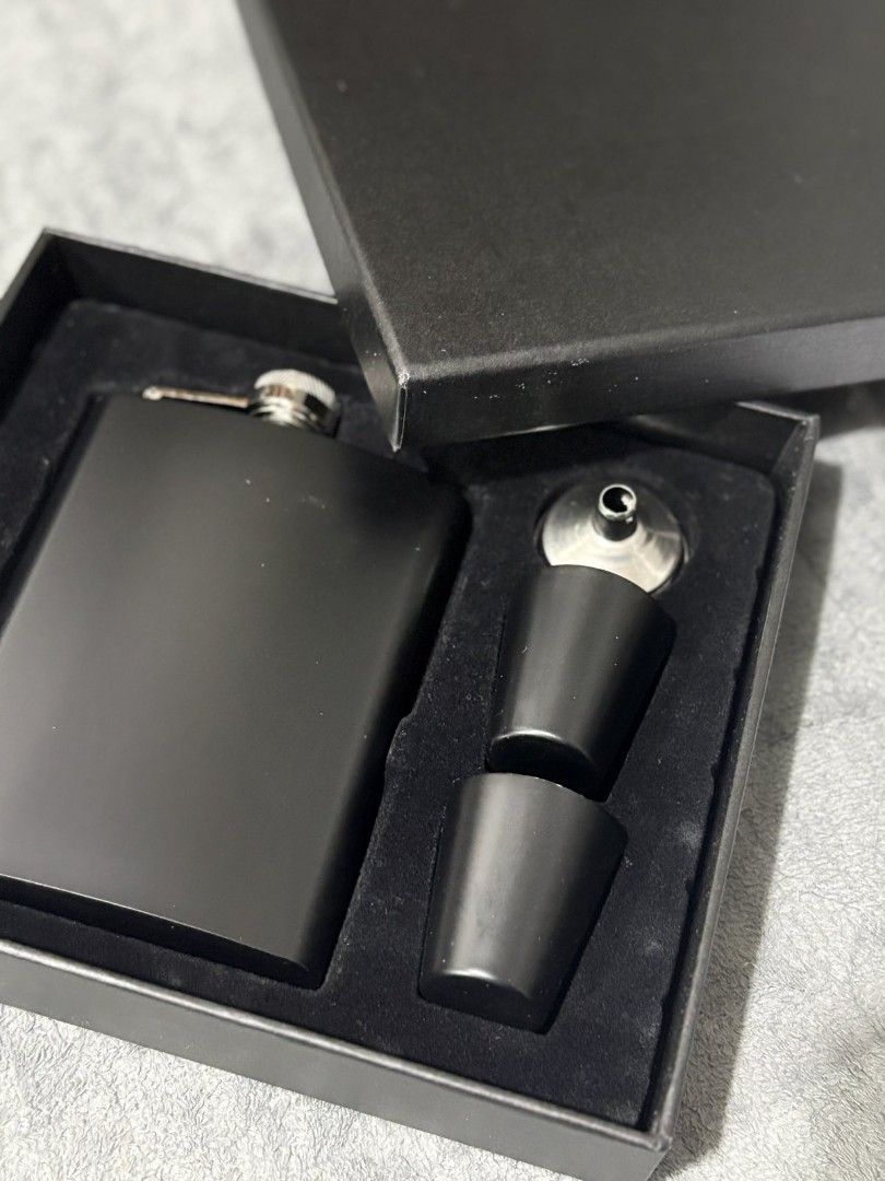 Black Flask with Two Shot Glasses and Funnel (Category: Water Bottles & Tumblers) located in Pasig City. Submitted by rnr2026 (Listing ID 1464215788, Image 3). Description: - Matte black flask set - Includes 2 shot glasses and a funnel - Presented in a sleek black gift box - Ideal for personal use or as a thoughtful gift - Classic flask shape, shot glasses fit snugly - Ready for your next adventure or celebration.