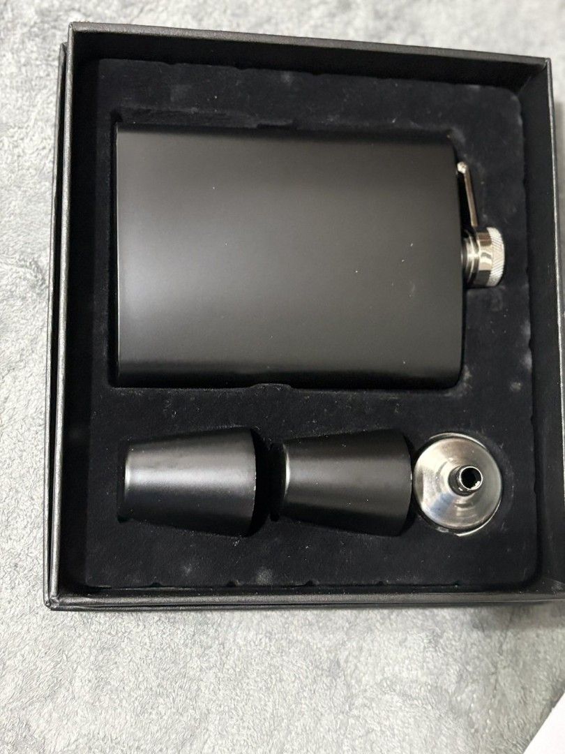 Black Flask with Two Shot Glasses and Funnel (Category: Water Bottles & Tumblers) located in Pasig City. Submitted by rnr2026 (Listing ID 1464215788, Image 2). Description: - Matte black flask set - Includes 2 shot glasses and a funnel - Presented in a sleek black gift box - Ideal for personal use or as a thoughtful gift - Classic flask shape, shot glasses fit snugly - Ready for your next adventure or celebration.