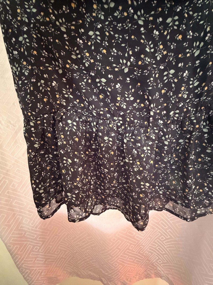 Black Floral Print Ruffle Skirt (Category: Skirts) located in Manila. Submitted by janellecas75114 (Listing ID 1464162106, Image 3). Description: - Cute black skirt - Ditsy floral print - Ruffled detail - Tiered hem - Lightweight and flowy fabric - Perfect for dressing up or down.