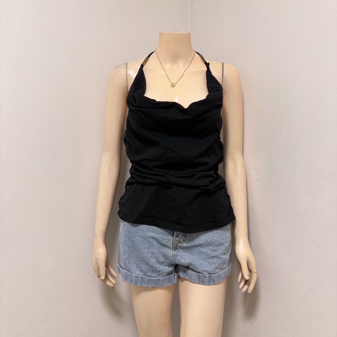 Black Halter Neck Top with Cowl Neckline (Category: Sleeveless) located in Imus. Submitted by reloved.nd (Listing ID 1464258393, Image 1). Description: - Black halter neck top - Elegant cowl neckline - Straps with subtle metallic detail - Ruched sides for a flattering fit - Perfect for dressing up or down.