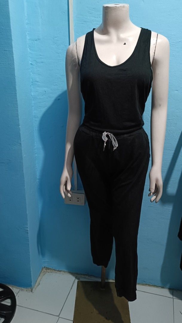 Black jumpsuit (Category: Sets or Coordinates) located in Quezon City. Submitted by davidclothing (Listing ID 1464154196, Image 1). Description: - Comfy black tank top and matching pajama pants set - Tank features a stylish racerback design - Pants have an adjustable drawstring waist for a perfect fit - Made from soft, comfortable material for ultimate relaxation - Ideal for lounging at home in style and comfort.
