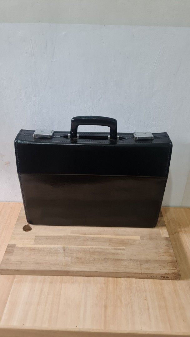 Black Leather Briefcase with Silver Clasps (Category: Briefcases) located in Caloocan City. Submitted by royaldragon_d59aba (Listing ID 1464264223, Image 1). Description: - Classic black leather briefcase - Sturdy handle - Two secure silver clasps - Ample space for documents and laptop - Ideal for work or travel - Shows some signs of wear, but in good overall condition.