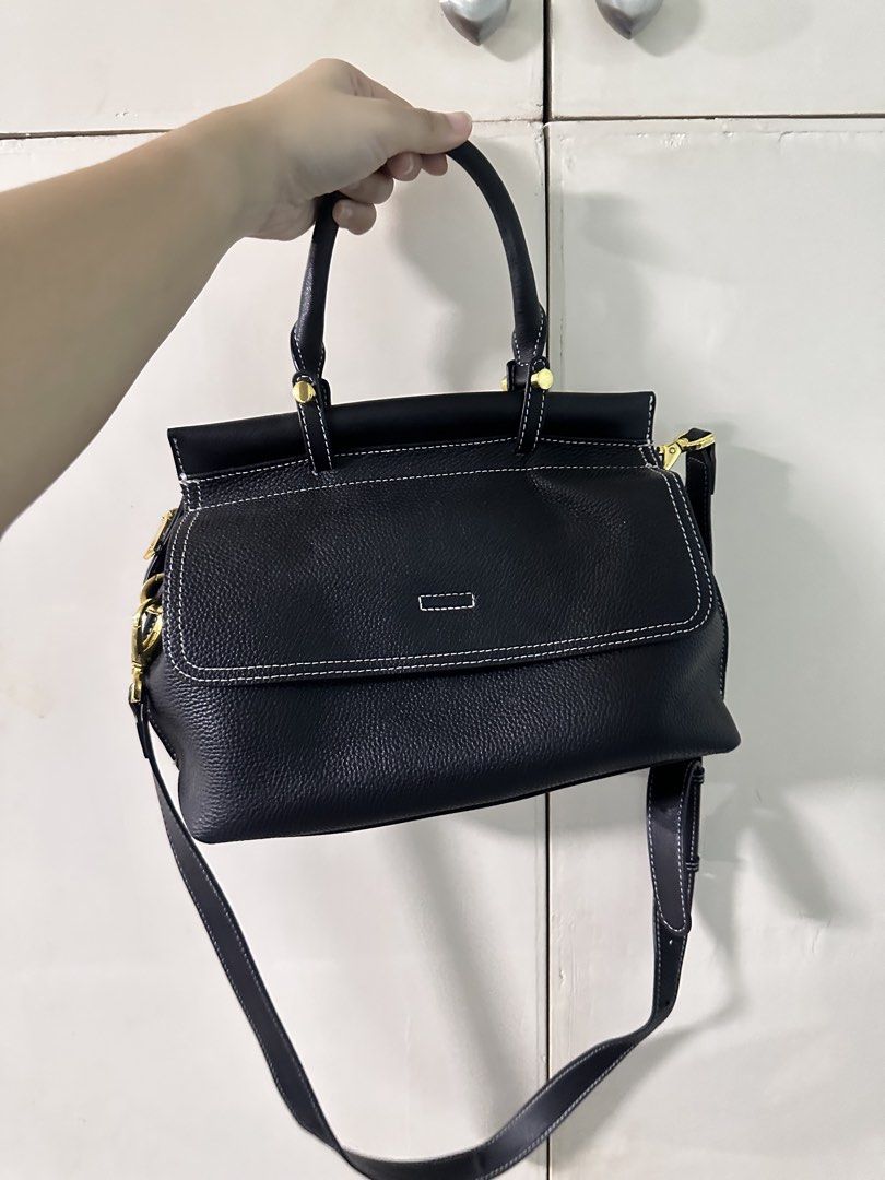 Black Leather Handbag / Sling Bag (BUNDLE SALE) (Category: Luxury Bags & Wallets) located in Quezon City. Submitted by bentabelles (Listing ID 1464230264, Image 2). Description: - BUNDLE PRICE! 600 for only 2 bags - seldom used, both in good condition - first bag is authentic cow leather (Royal Bagger brand), originally bought for 2,000 pesos; very spacious & has two compartments, can be hand or sling bag - second bag can be hand or body (comes w
