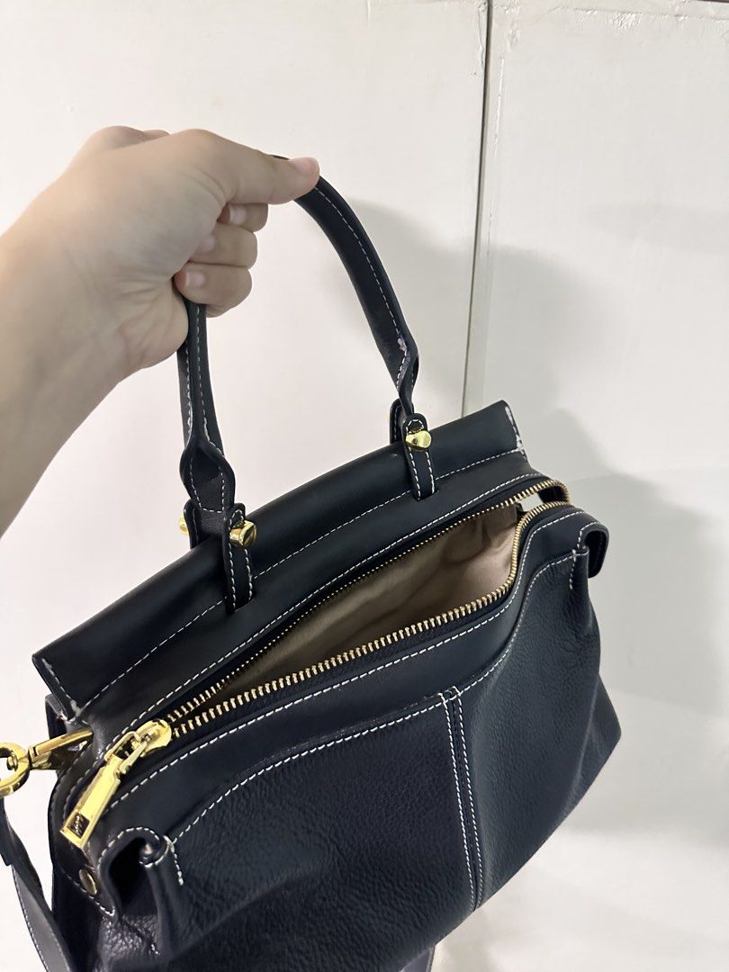 Black Leather Handbag / Sling Bag (BUNDLE SALE) (Category: Luxury Bags & Wallets) located in Quezon City. Submitted by bentabelles (Listing ID 1464230264, Image 3). Description: - BUNDLE PRICE! 600 for only 2 bags - seldom used, both in good condition - first bag is authentic cow leather (Royal Bagger brand), originally bought for 2,000 pesos; very spacious & has two compartments, can be hand or sling bag - second bag can be hand or body (comes w