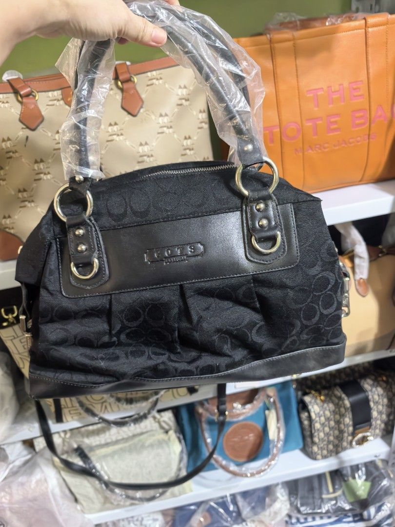Black Monogram Canvas Leather Trim Handbag/shoulder bag (Category: Shoulder Bags) located in Manila. Submitted by mysticfox.9b1678 (Listing ID 1461018779, Image 3). Description: - black Tote Bag - Signature monogram pattern - Black leather trim and handles (handles still in original plastic wrap) - Spacious interior - Ideal for everyday use - Timeless, classic design.