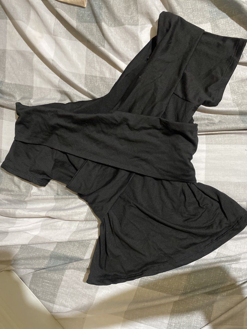 Black Off-Shoulder Ruffle Top (Category: Sleeveless) located in San Fernando. Submitted by kimaijoo (Listing ID 1464151872, Image 1). Description: - Stylish black off-shoulder top - Features elegant ruffle details - Comfortable short sleeves - Made from soft and stretchy fabric - Versatile for casual outings or nights out - Easily pairs with jeans or skirts.