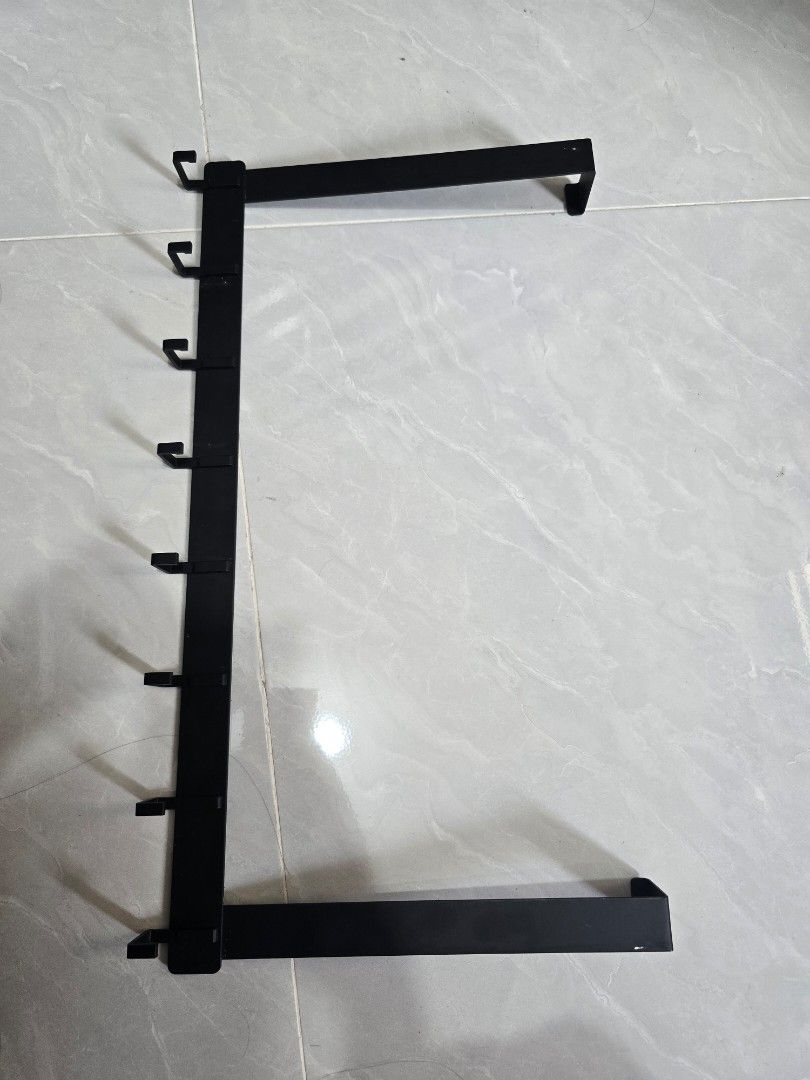 Black Over-the-Door Hook Rack with 8 Hooks (Category: Hooks & Hangers) located in Manila. Submitted by justliber27074 (Listing ID 1464167573, Image 1). Description: - Black metal hook rack - Hangs over doors - 8 hooks for coats, bags, or towels - Dimensions: 520mm (width) x 280mm (height) - Easy, no-tool installation - Ideal for space organization I'm an affiliate selling some stuff I got, new or like new and at a discounted price. Follow me for 