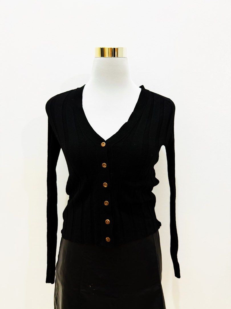 Black Ribbed Button-Up V-Neck Cardigan (Category: Coats, Jackets and Outerwear) located in Manila. Submitted by e.louise (Listing ID 1464333232, Image 3). Description: - Classic black cardigan - Ribbed texture all over - V-neckline with button-up front - Long sleeves - Versatile for layering - Pairs well with jeans or skirts.