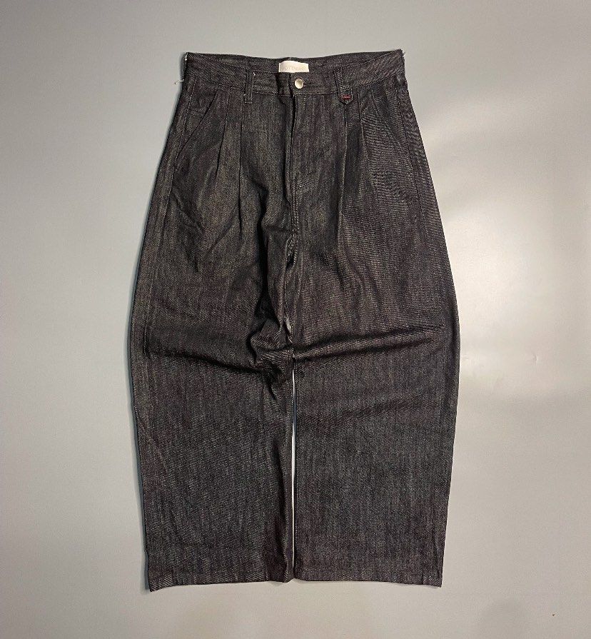 Black Shiny Raw Denim Fottners (Category: Jeans) located in Batangas. Submitted by bmrlne (Listing ID 1464181977, Image 2). Description: - size 32 Korean Brand [Mint Condition] Dark wash denim jeans - Wide leg silhouette with front pleats - Relaxed fit for comfort - Button and zip fly closure - Two front and two back pockets - Distinctive pink tag on the back waistband.