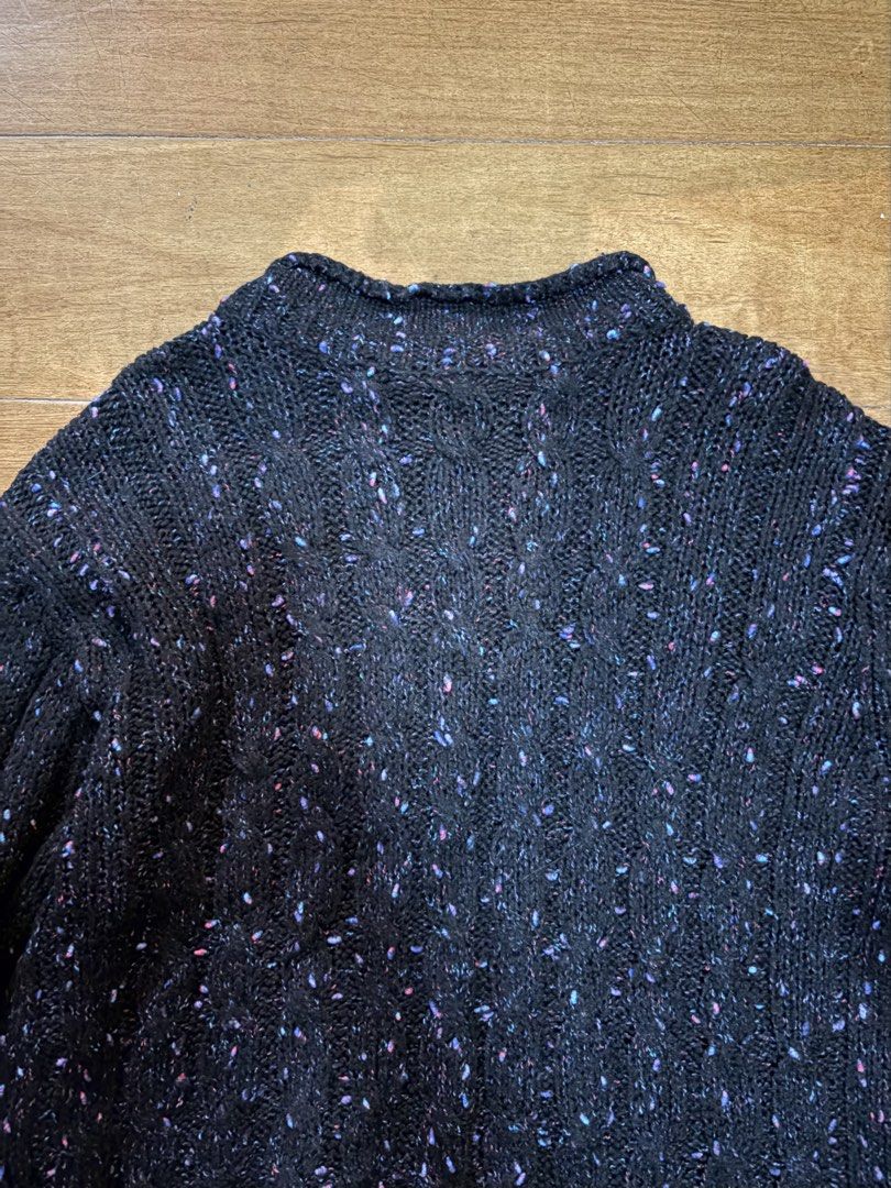 Black Speckled Knit Mock Neck Sweater (Category: Longsleeves) located in Muntinlupa City. Submitted by secondhandlove12345 (Listing ID 1464277261, Image 2). Description: - Cozy black knit sweater - Speckled pattern with hints of purple and pink - Mock neck design - Long sleeves - Versatile for layering or standalone wear - Pairs well with jeans or skirts.