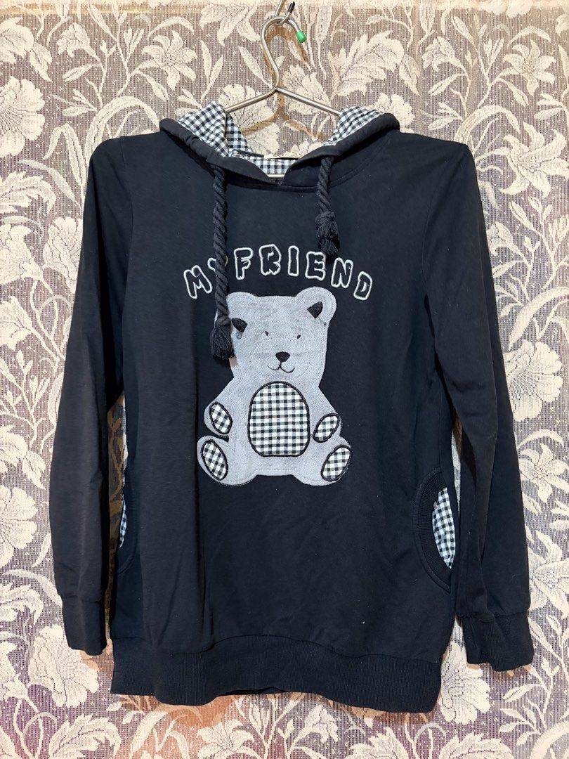 Black Teddy Bear Hoodie with Gingham Details (Category: Coats, Jackets and Outerwear) located in Baguio. Submitted by danielle.finds (Listing ID 1464203373, Image 1). Description: - Cute black hoodie - Features a 'MY FRIEND' teddy bear graphic on the front - Gingham lining inside the hood - Stylish pocket details - Long sleeves with ribbed cuffs and hem - Comfortable and fashionable.