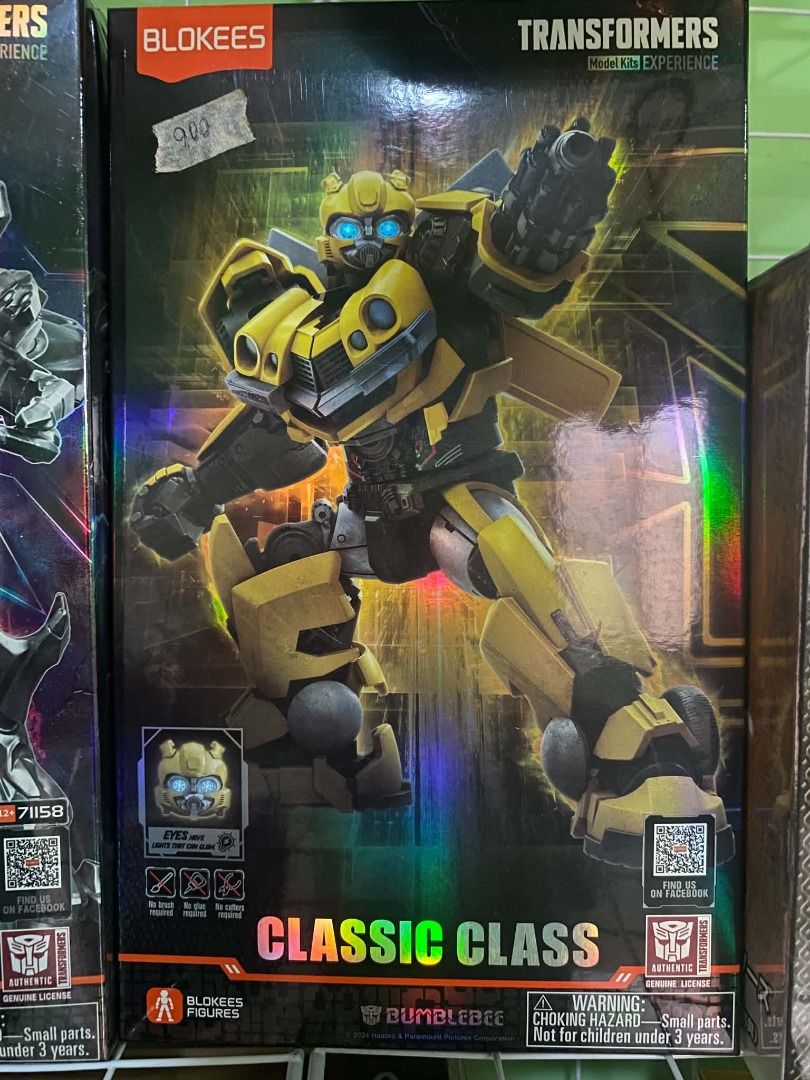 Blokees Transformers Bumblebee Classic Class Model Kit (Category: Action & Battle Toys) located in Angeles City. Submitted by rickki_t (Listing ID 1464219625, Image 1). Description: - Build your own iconic Bumblebee Transformer! - Classic Class model kit experience. - Box shows original price tag of ₱900. - Warning: Choking hazard due to small parts. - Not suitable for children under 3 years old..