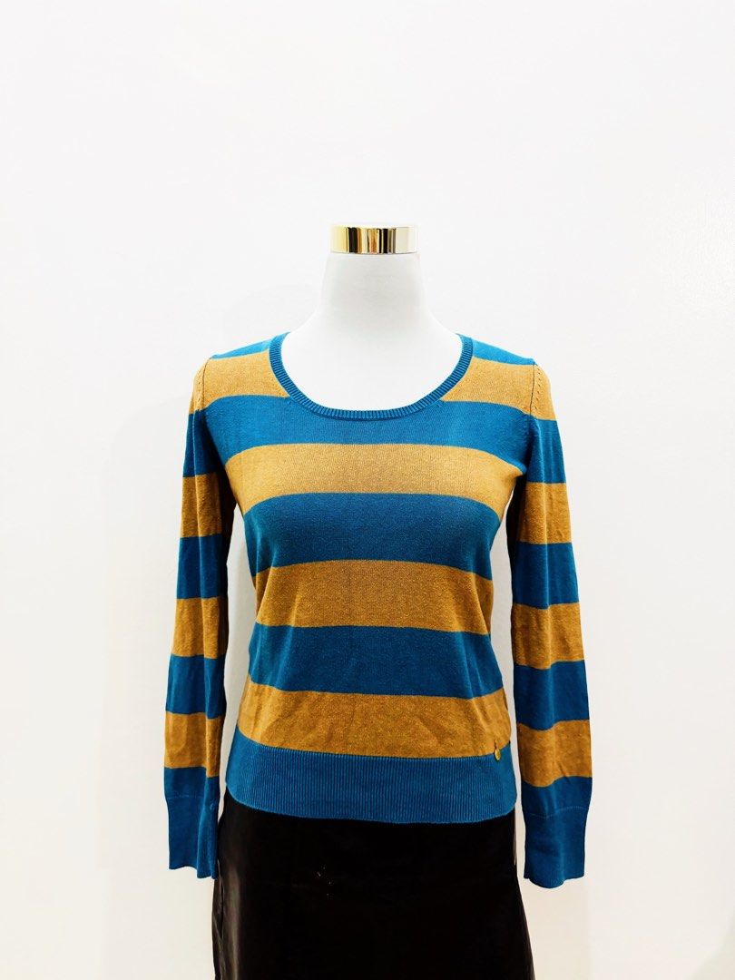 Blue and Tan Striped Long Sleeve Sweater (Category: Longsleeves) located in Manila. Submitted by e.louise (Listing ID 1464332886, Image 1). Description: - Blue and tan striped long sleeve sweater - Classic crew neck design - Ribbed cuffs and hem for a snug fit - Subtle gold charm detail near the hem - Versatile for layering or standalone wear.