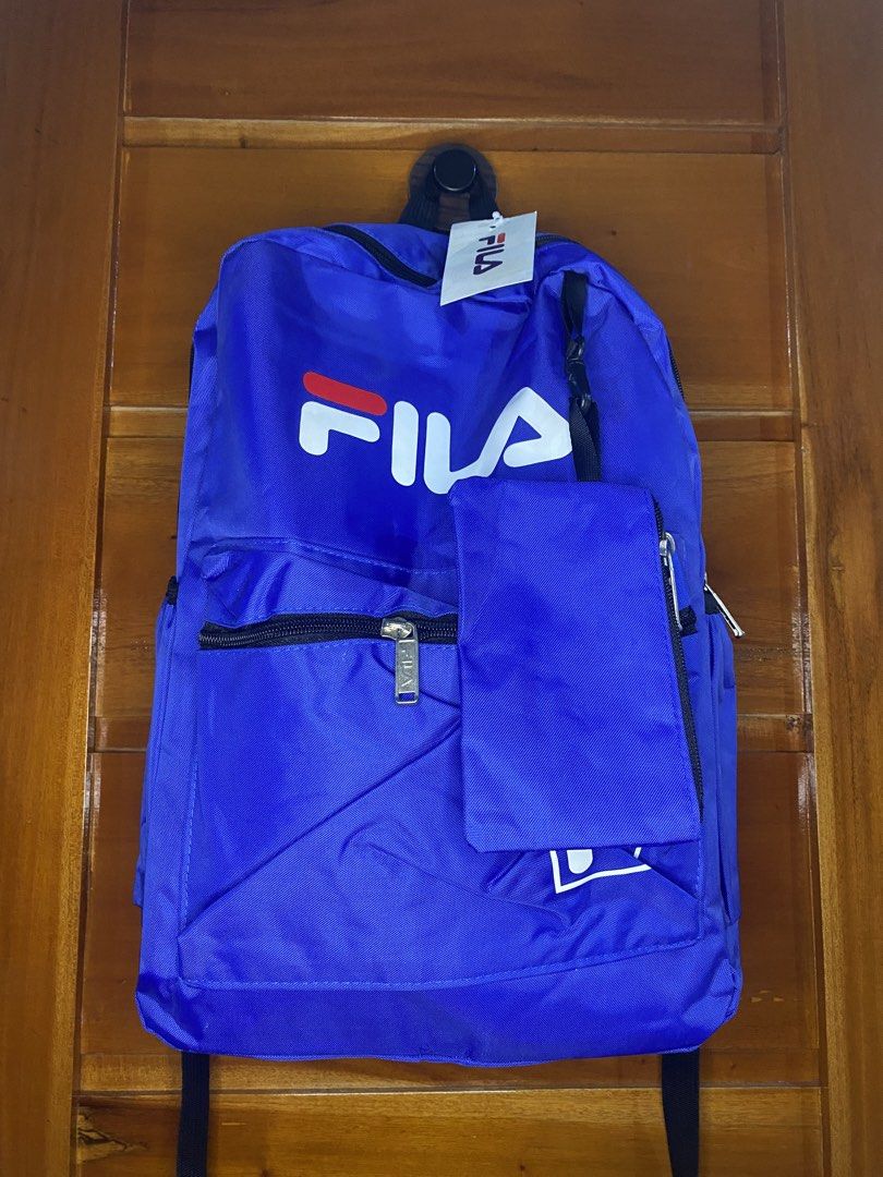 Blue Fila Backpack with Pouch (Category: Backpacks) located in Manila. Submitted by heath2600 (Listing ID 1464299847, Image 1). Description: - Classic blue Fila backpack - Large main compartment - Front zip pocket - Detachable front pouch included - Durable material - Simple and functional design - Perfect for school or everyday use.