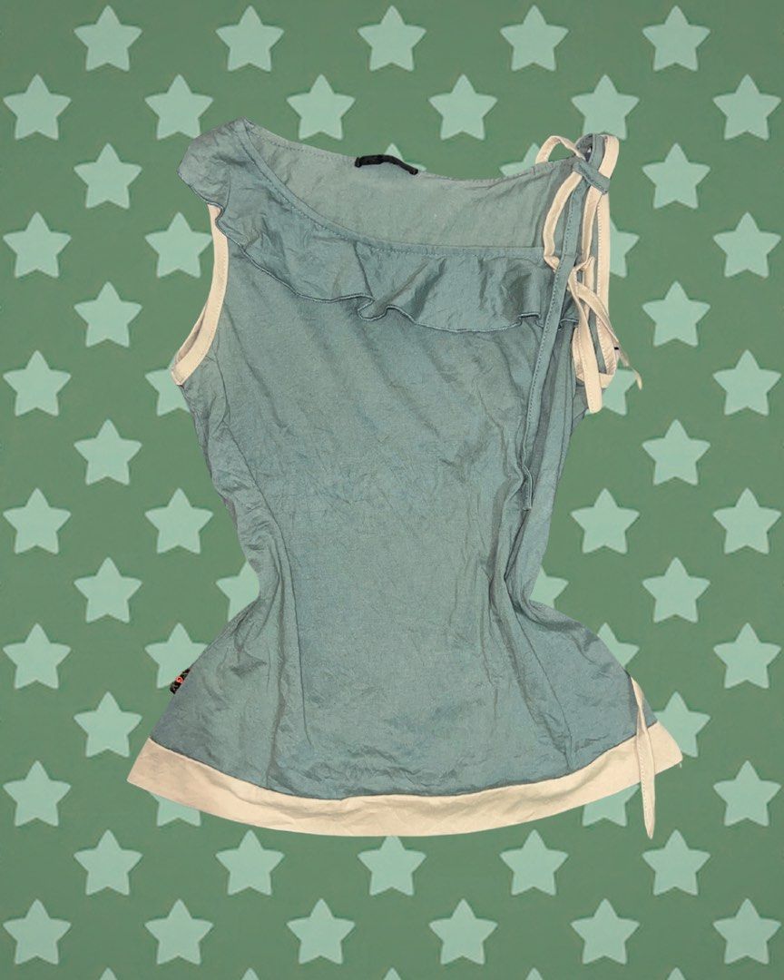 Blue Ruffle One Shoulder Top with Tie Details (Category: Sleeveless) located in Tuguegarao City. Submitted by love_clothies (Listing ID 1464247104, Image 1). Description: - Adorable blue one-shoulder top - Features ruffle detail on the neckline - Stylish tie details on the shoulder and side - Contrasting cream trim along the hem and neckline - Made from lightweight and airy fabric - Ideal for a casual day out.