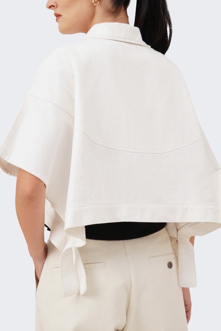 BOCU White Denim Cropped Shirt (Category: Shirts) located in Pasig City. Submitted by rizzzzahh (Listing ID 1464275631, Image 2). Description: BOCU White cropped denim shirt Size on Tag: S/M Fits Medium to Large - Versatile for layering or wearing alone Excellent Condition Used once only RFS: Decluttering Closet.