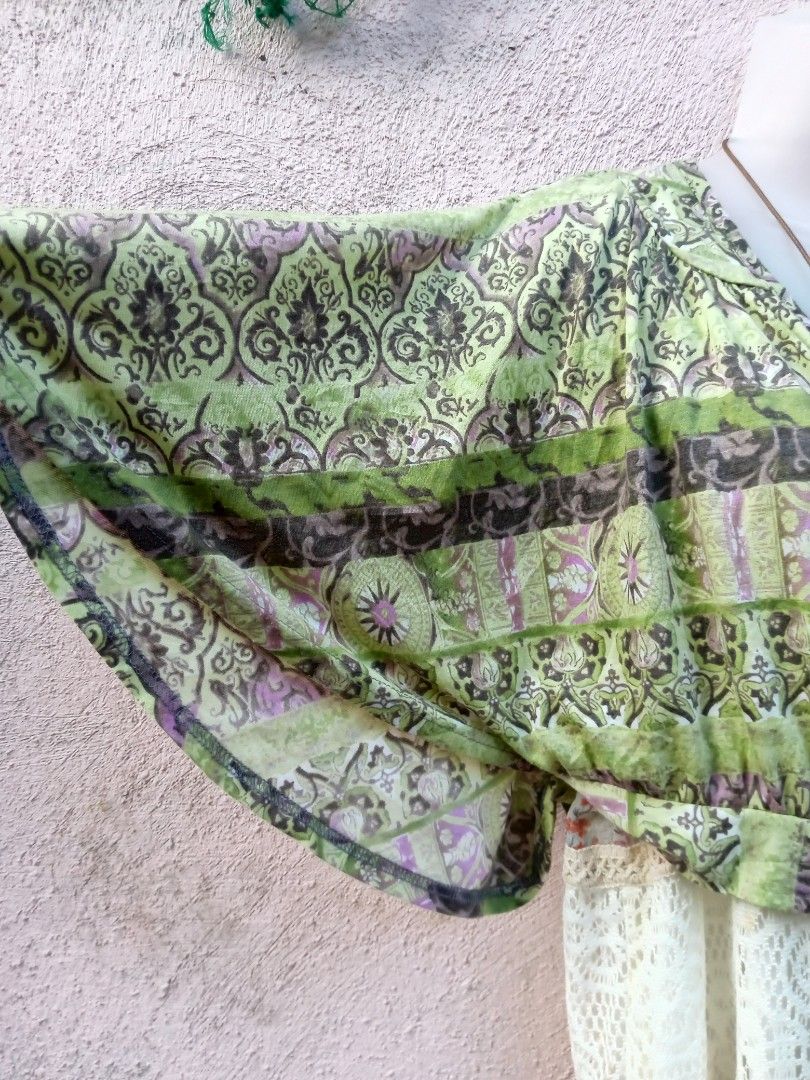 Boho Green Patterned Kimono Cardigan with Tie Front (Category: Coats, Jackets and Outerwear) located in Placer. Submitted by whimsythrifts (Listing ID 1464204497, Image 2). Description: - Lightweight kimono-style cardigan - Vibrant green and purple bohemian print - Short, fluttery sleeves - Ties at the front - Ideal for casual, free-spirited layering over dresses or tops +sf.