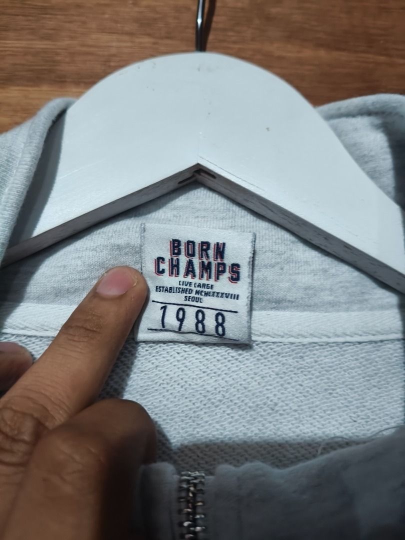 BORN CHAMPS 1988 Half Zip Sweatshirt Grey (Category: Coats, Jackets and Outerwear) located in Cotabato. Submitted by grandwolf-98e8 (Listing ID 1464277928, Image 3). Description: - Brand: BORN CHAMPS - Color: Grey - Style: Half-zip sweatshirt - Features: High collar, ribbed cuffs, ribbed hem - Occasion: Casual wear - Styling: Easy to pair with various outfits.