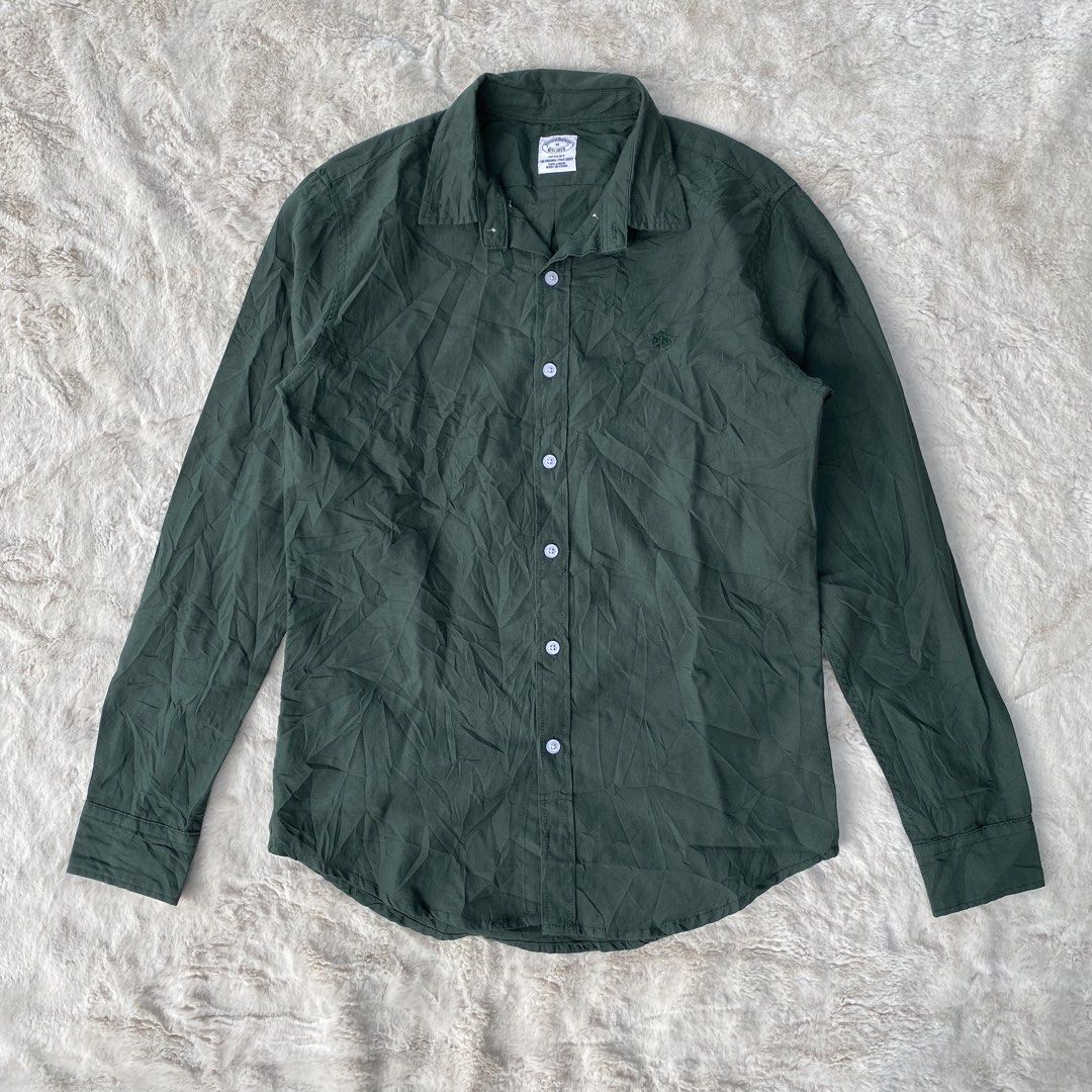 BROOKS BROTHERS BUTTON DOWN POLO LONG SLEEVE AUTHENTIC (Category: Coats, Jackets and Outerwear) located in Cadiz. Submitted by thrift_hunt_garage (Listing ID 1464274869, Image 1). Description: BROOKS BROTHERS BUTTON DOWN LONG SLEEVE POLO AUTHENTIC Size and measurements by inches : On tag Medium Width 19 Length 27 Sleeve 25 Conditions and details : Linen material Military green colorway Chest embroided logo Issue none Flaws none.