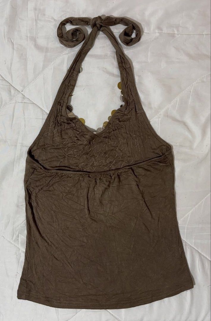 Brown Halter Top with Sequins (Category: Sleeveless) located in Caloocan City. Submitted by mmc1999 (Listing ID 1464293667, Image 2). Description: - Brown halter top - Sparkly sequin detail around the neckline - Ties at the neck for adjustable fit - Gathered elastic waistband at the back - Ideal for a night out or casual party.