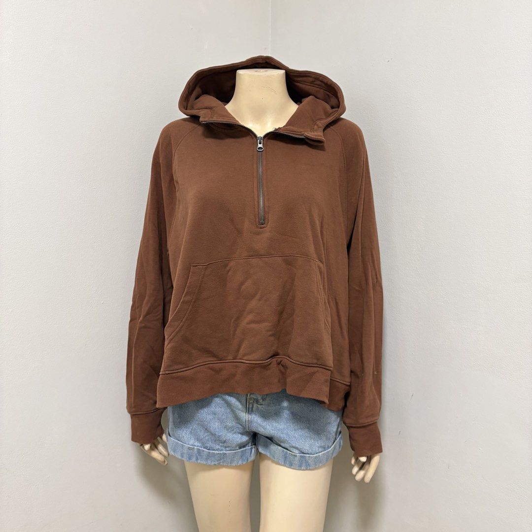 Brown Quarter Zip Hoodie (Category: Coats, Jackets and Outerwear) located in Imus. Submitted by reloved.nd (Listing ID 1464251845, Image 1). Description: - Cozy brown hoodie - Quarter zip neckline - Large front pouch pocket - Long sleeves with ribbed cuffs - Ribbed hem - Ideal for casual wear or layering - Versatile styling with jeans or shorts.