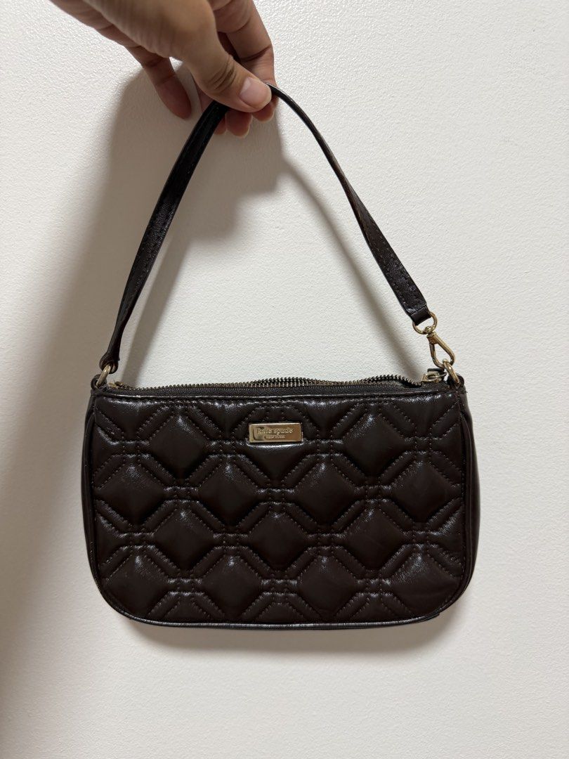 Kate Spade - Brown Quilted Shoulder Bag (Category: Shoulder Bags) located in Paranaque City. Submitted by ferrewr (Listing ID 1464353252, Image 1). Description: - Cute brown shoulder bag (used to be white - leather painted it brown) - All-over quilted pattern - Zipper closure - Small gold logo plate on the front - Perfect size for essentials - Easy to carry - 100% authentic / original .
