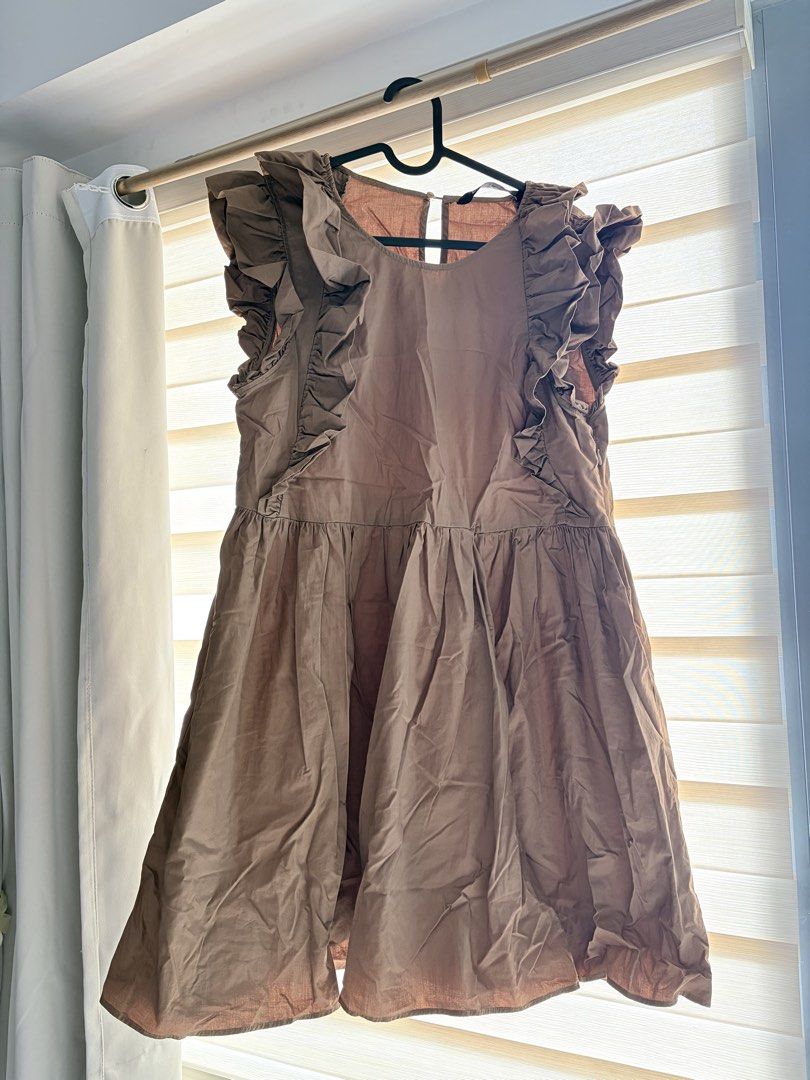 Brown Ruffled Cap Sleeve A-Line Dress (Category: Dresses) located in Manila. Submitted by cheska.closet18 (Listing ID 1464178264, Image 1). Description: - Cute brown dress - Ruffled cap sleeves - Gathered waist - Flowy A-line skirt - Sleeveless design with cap sleeves - Small keyhole opening at the back - Ideal for casual outings or a day out.