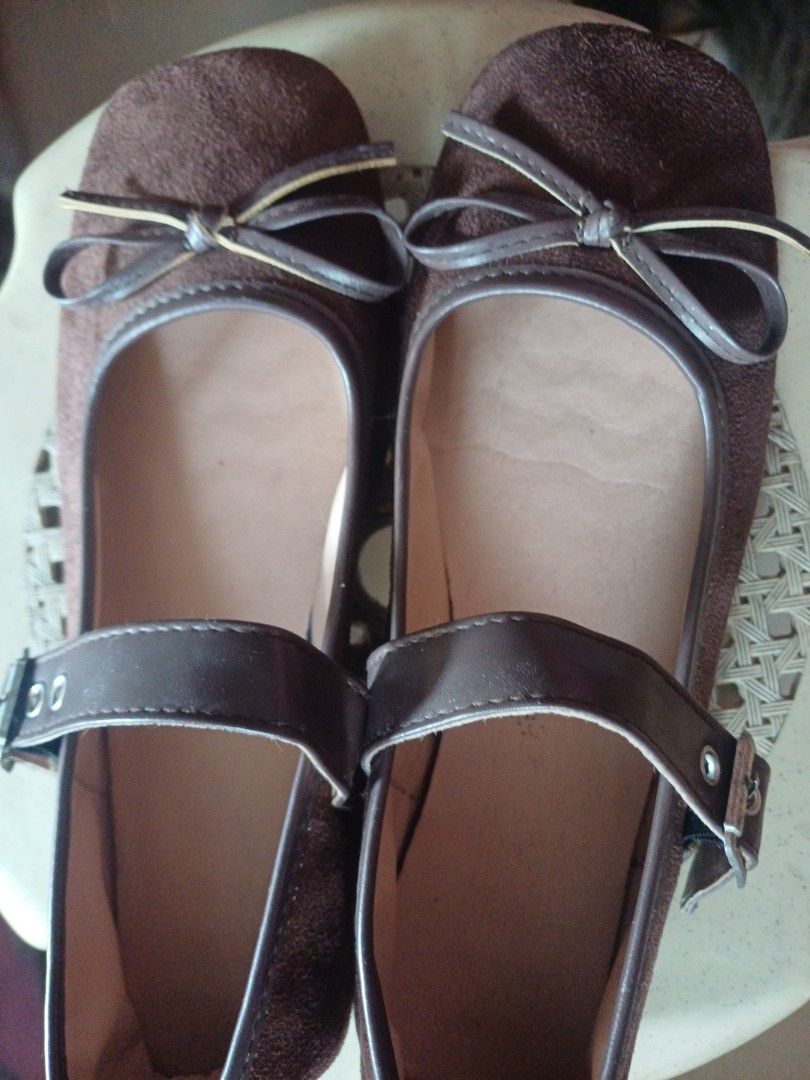 Brown Suede Ballet Flats with Strap - Size 40 (Category: Flats & Sandals) located in Manila. Submitted by kaela_listing (Listing ID 1464189414, Image 1). Description: - Chic brown suede ballet flats - Size 40 - Secure buckle strap closure across the top - Adorable small bow detail on the toe - Ideal for comfortable and stylish casual wear.