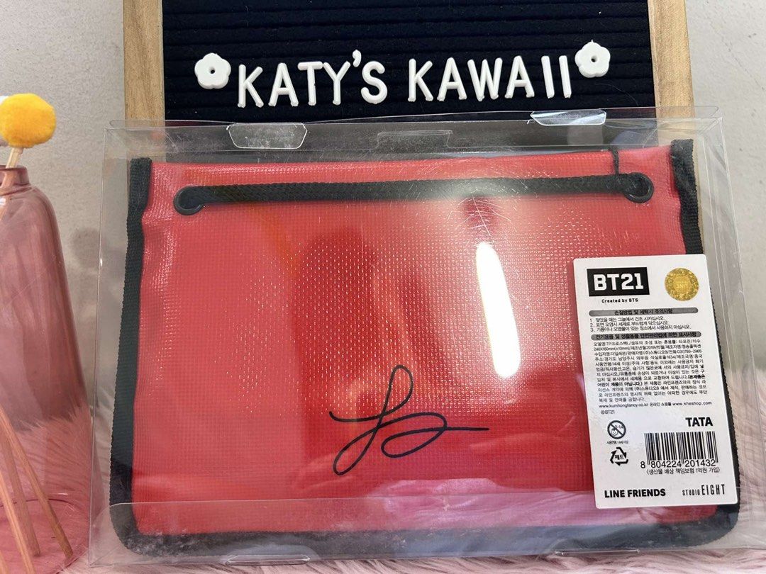 BT21 TATA Red Pouch Cosmetic Bag (Category: Purses & Pouches) located in Manila. Submitted by vintage_vibemanila (Listing ID 1464334615, Image 2). Description: - Adorable red pouch featuring TATA from BT21. - Secure zipper closure. - Perfect for storing makeup, stationery, or other essentials. - Officially licensed LINE FRIENDS product. - Convenient size: approximately 25cm x 15cm. - Great for everyday use..