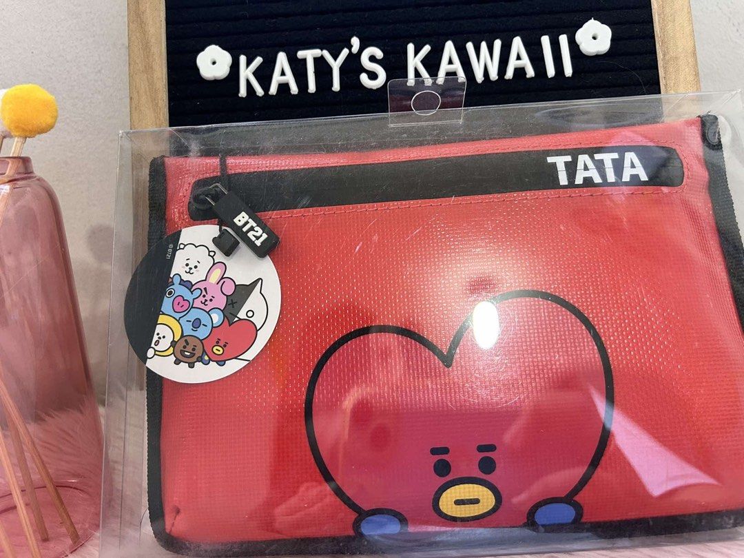 BT21 TATA Red Pouch Cosmetic Bag (Category: Purses & Pouches) located in Manila. Submitted by vintage_vibemanila (Listing ID 1464334615, Image 1). Description: - Adorable red pouch featuring TATA from BT21. - Secure zipper closure. - Perfect for storing makeup, stationery, or other essentials. - Officially licensed LINE FRIENDS product. - Convenient size: approximately 25cm x 15cm. - Great for everyday use..