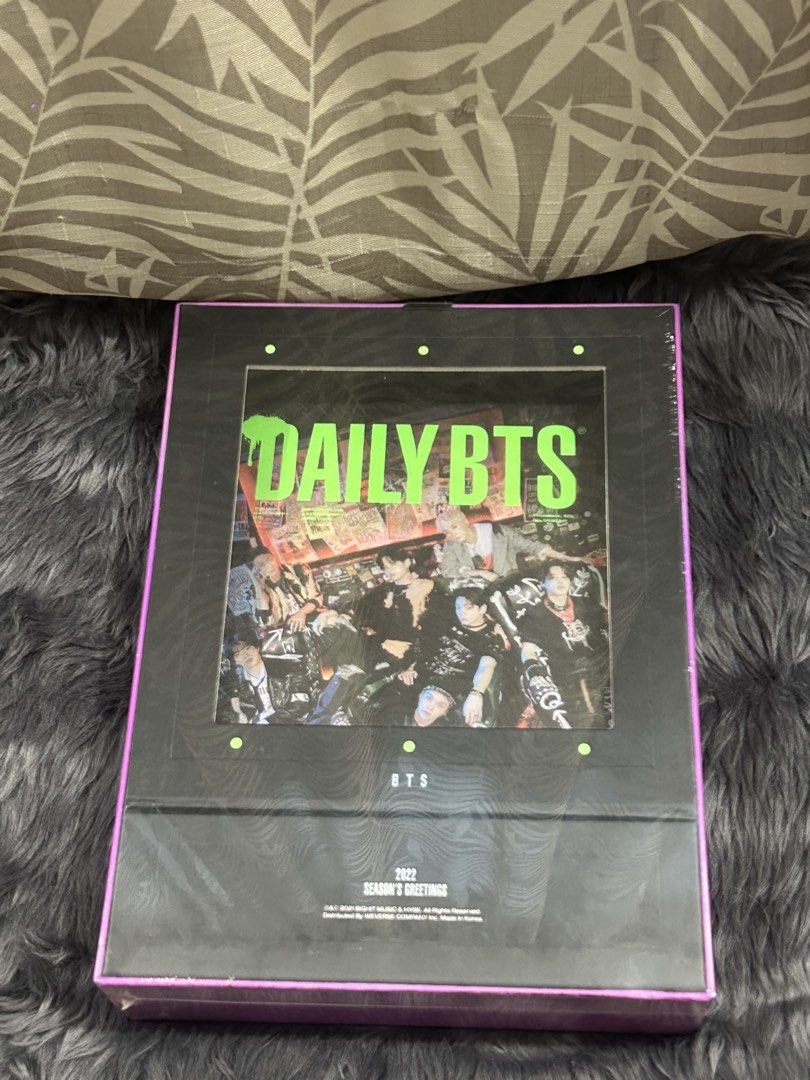 BTS 2022 Season's Greetings Box Set (Category: K-Wave Merchandise) located in Cabiao. Submitted by hoardercanthelpit (Listing ID 1464210917, Image 1). Description: - Official BTS 2022 Season's Greetings box - Features all 7 members: RM, Jin, Suga, J-Hope, Jimin, V, Jungkook - Eye-catching holographic purple and green packaging - Perfect addition to any ARMY's collection - Authentic BTS merchandise plus calendar posters.