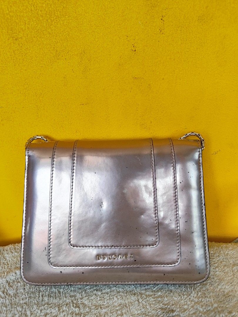 Bulgari Serpenti Shoulder Bag Pink Metallic (Category: Luxury Bags & Wallets) located in Cebu City. Submitted by cherreymie70208 (Listing ID 1464154208, Image 3). Description: - Eye-catching pink metallic shoulder bag - Features the signature Bulgari snake head detail - Comes with a stylish chain strap - Interior serial number tag for authenticity - Minor marks on the exterior, adding character - Perfect statement piece to elevate any outfit.