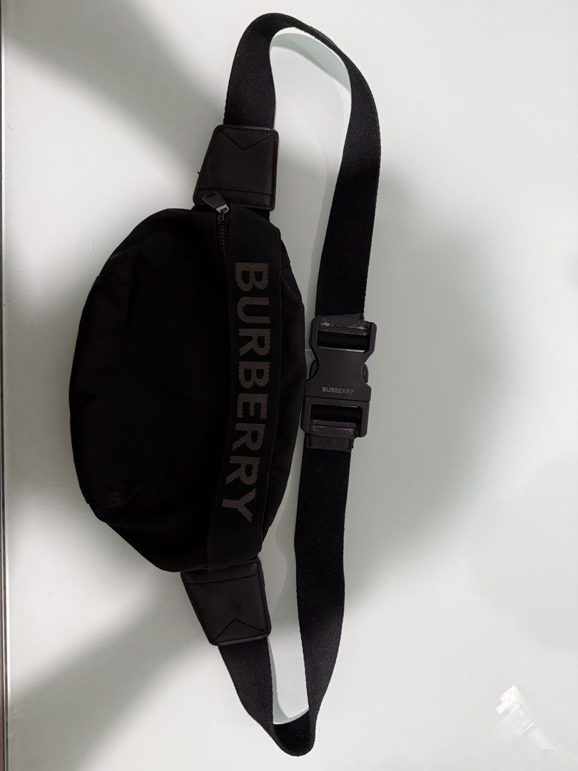 Burberry Black Nylon Belt Bag with Logo Strap (Category: Luxury Bags & Wallets) located in Manila. Submitted by youngforest.c07079 (Listing ID 1464331949, Image 2). Description: Selling a pre-loved original Burberry black nylon belt / cross-body bag with the bold Burberry logo and engraved buckle hardware. Brand: Burberry (Original) Material: Durable Nylon with metal/matte hardware Condition: Pre-loved / Good condition Price: ₱1,100 Delivery: Buy