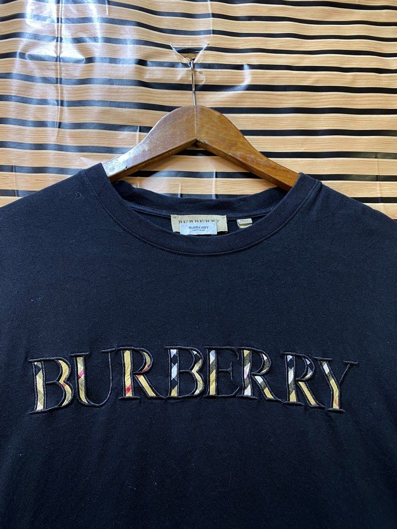 BURBERRY “DOUBLE TAG” TEE (Category: Tshirts & Polo Shirts ) located in Makati City. Submitted by drip.poww (Listing ID 1464233869, Image 3). Description: - Authentic Burberry - Color: Black - Size: XL - Dimes: 24x26 - Authentic - Excellent condition - Need wash, fresh from bale - Material: 100% Cotton Please don’t expect too much—these are thrifted (ukay) items. 😊 !!STILL NEGOTIABLE!!.