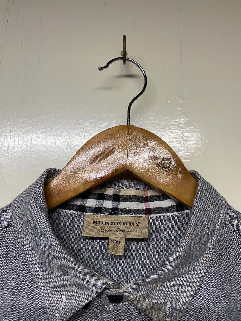 Burberry Men's Button Down Shirt XXL (Category: Formal Shirts) located in Pasig City. Submitted by jstnisidor81288 (Listing ID 1464235533, Image 2). Description: - Authentic Grey Burberry Button Down Shirt - Size: XXL - Classic Burberry check lining inside collar and cuffs - Embroidered Burberry logo on chest.