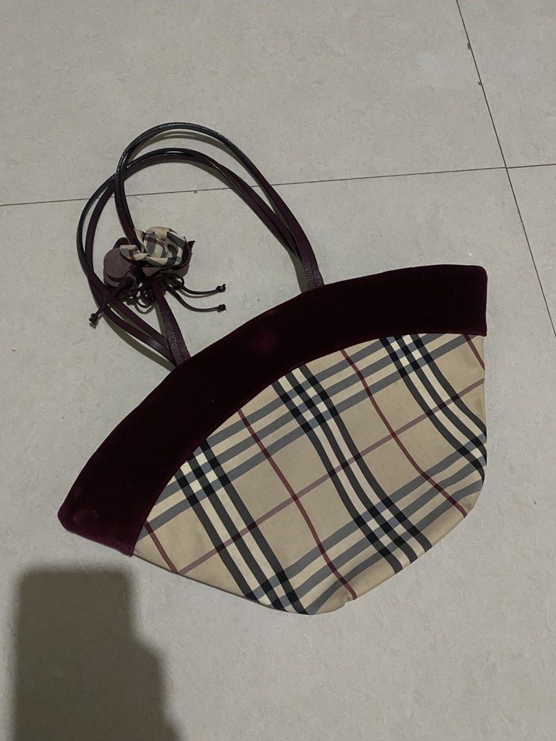 Burberry Nova Check Velvet Tote Bag (Category: Tote Bags) located in Taguig. Submitted by _lly.wyn (Listing ID 1464198683, Image 1). Description: - Classic Burberry tote bag - Iconic Nova Check pattern - Deep burgundy velvet trim - Interior zip pocket - Signature Burberry lining - Comes with dust bag - Ideal for everyday use or weekend getaways.