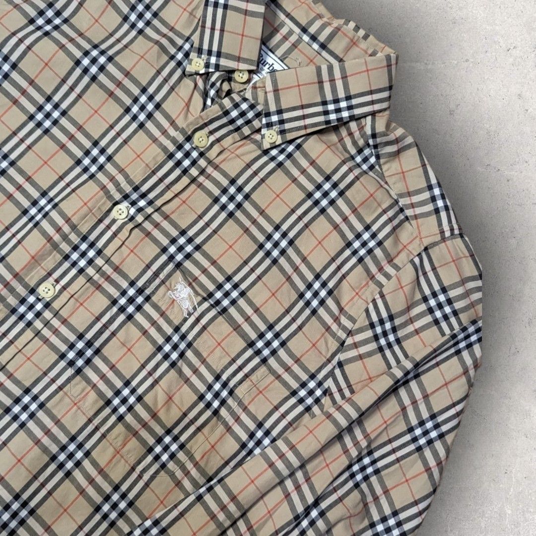 Burberry Plaid Long sleeve Polo (Category: Luxury Apparel) located in San Juan City. Submitted by 4keeps.mnl (Listing ID 1464279630, Image 3). Description: AUTHENTIC ✅ ORIGINAL Condition: 9.8/10 Large Issue: NONE.