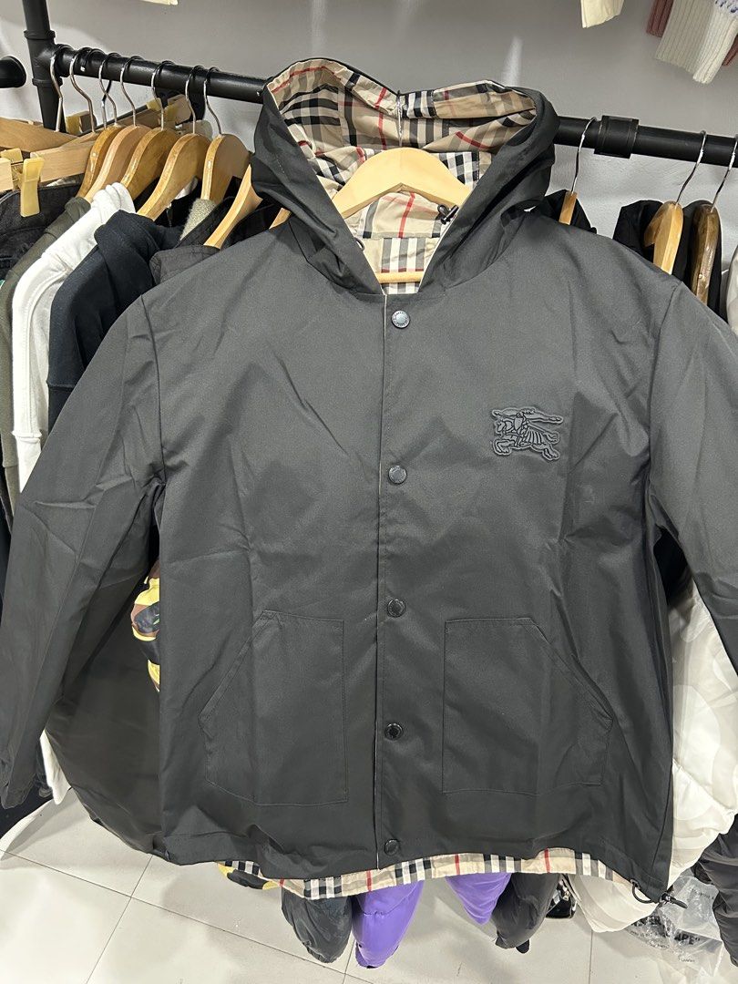 Burberry Reversible Check Hooded Jacket (Category: Luxury Apparel) located in Manila. Submitted by bodegabodega (Listing ID 1464170386, Image 1). Description: - Burberry Reversible Jacket - Two stylish sides: classic black with knight logo OR iconic Burberry check pattern - Hooded design for added style and protection - Secure button closure - Two functional front pockets on the black side - Perfect for versatile styling options Burberry London R