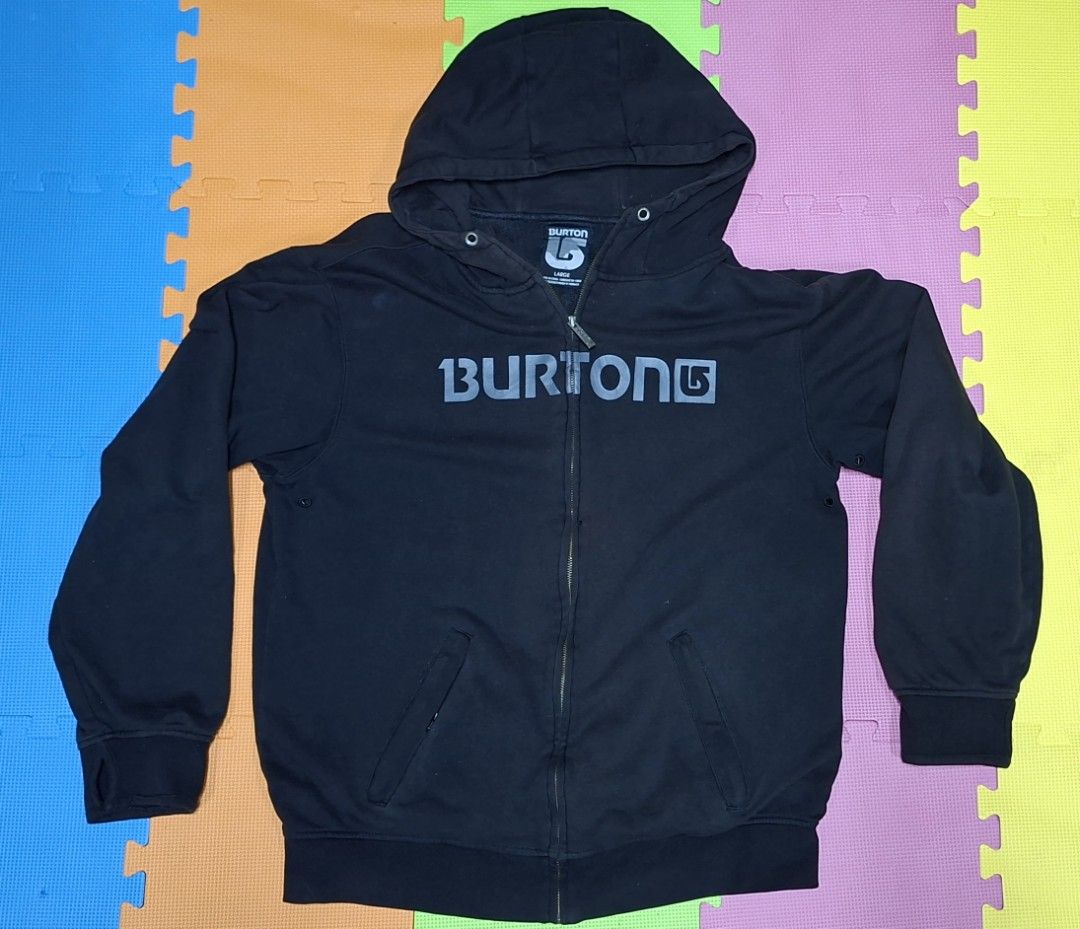 Burton Black Zip-Up Hoodie (Category: Hoodies) located in Manila. Submitted by declutrredgoods (Listing ID 1464284256, Image 1). Description: - Black Burton zip-up hoodie - Size: Large - Features iconic Burton logo on the front - Hooded design with full zip closure - Two convenient front pockets - Ribbed cuffs and hem for a snug fit.