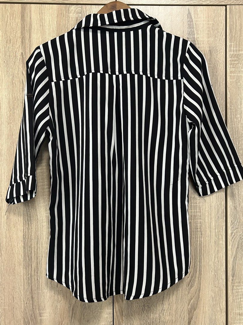 Button Down Shirt (Category: Blouses) located in Bulacan. Submitted by relove.re (Listing ID 1464142109, Image 2). Description: - Stripes black and white blouse - Size XS to S - With buttons oe button down style - Lose shirt and Longsleeves (can be used as 3/4s) with side button.
