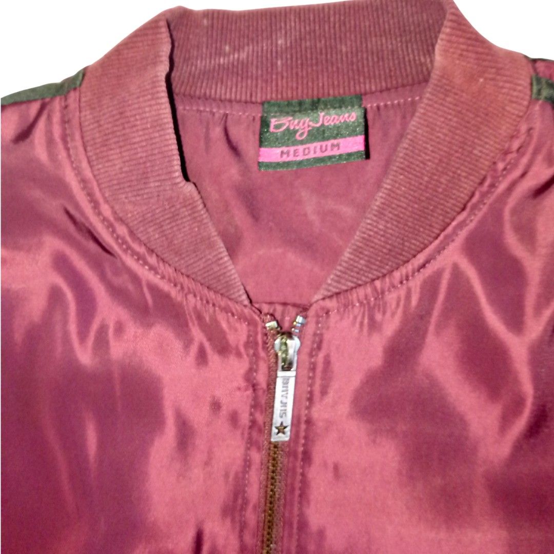 Buy Jeans Burgundy Bomber Jacket Medium (Category: Coats, Jackets and Outerwear) located in Baguio. Submitted by tequilamojito (Listing ID 1464265326, Image 3). Description: - Burgundy bomber jacket - Brand: Buy Jeans - Size: Medium - Features: Zip-up front, two side pockets - Details: Ribbed collar, cuffs, and hem - Interior: Shiny lining - Style: Great for casual wear.