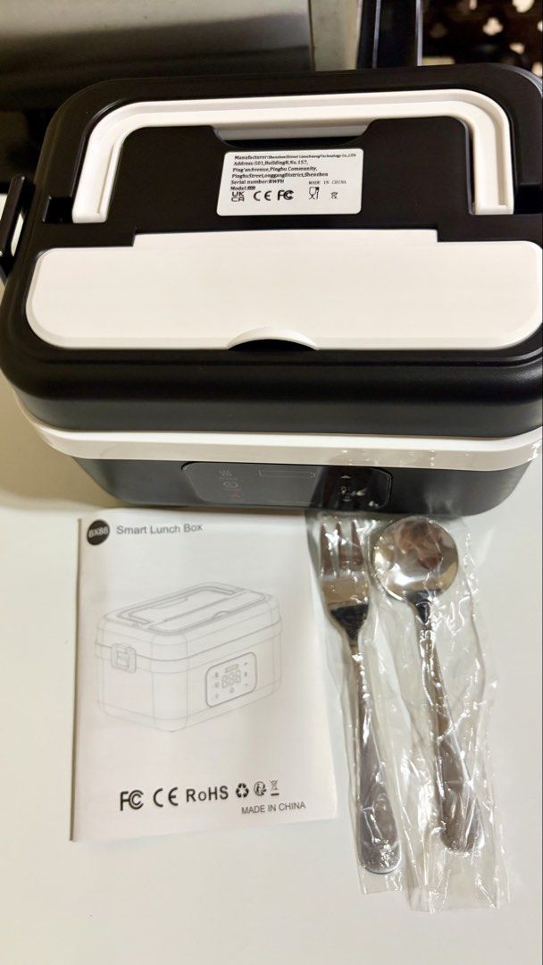 BX88 Smart Lunch Box (Category: Food Organization & Storage) located in Manila. Submitted by lizziedear.lizziedear (Listing ID 1464153530, Image 1). Description: - BX 88 Smart Lunch Box - Stainless steel inner container - Features a timer dial on the lid - Cordless, battery powered food warmer that heats or maintain ls the temperature of your meals on the go without requiring an outlet - Ideal for convenient meals on the go - Comes with insulated